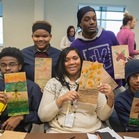 group holding paper bags
